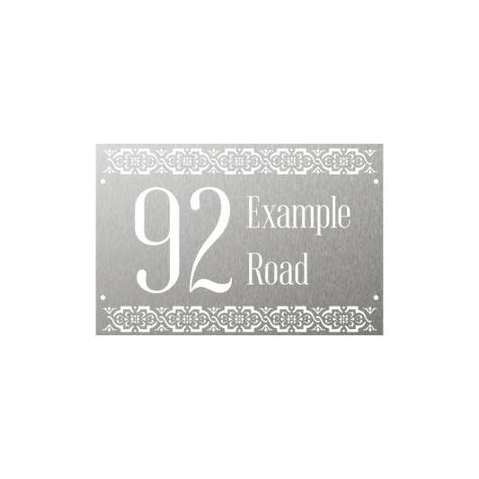Rectangular metal house number with beautiful patterns on the top and bottom borders