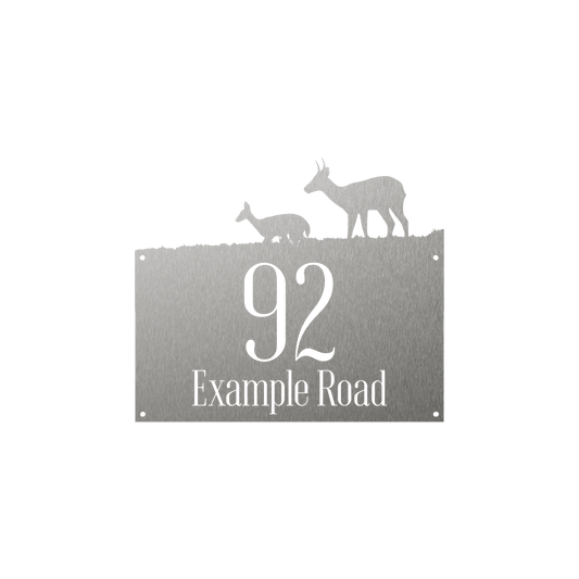 Rectangular house number with reedbuck and lamb walking through grass silhouette on top